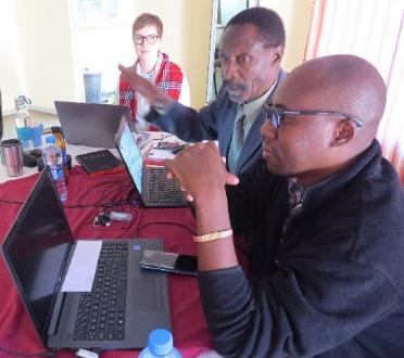 Translation consultant Emese Ferreira working with George and Blessings