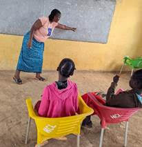 Children learning in a literacy outreach class in Zambia