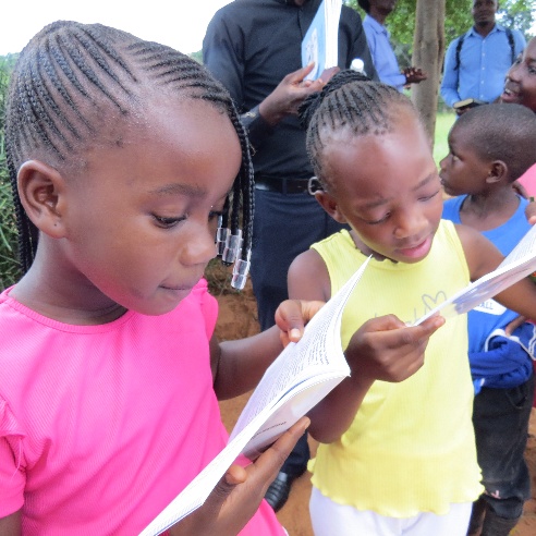 Children in Mukuni chiefdom reading Toka-Leya Scriptures in their own language