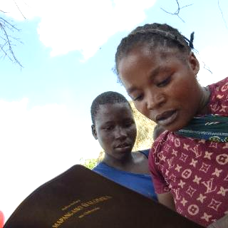 Young mothers reading Scripture in Mulila Village