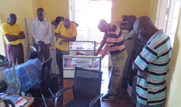 Toka-Leya team praying in every room of their new office