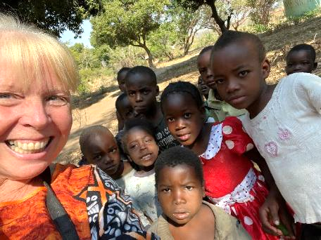 Sue with children in Malama village