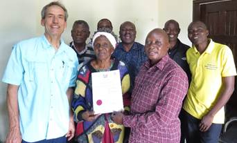 Ken Sawka with Toka-Leya committee members after completing government registration